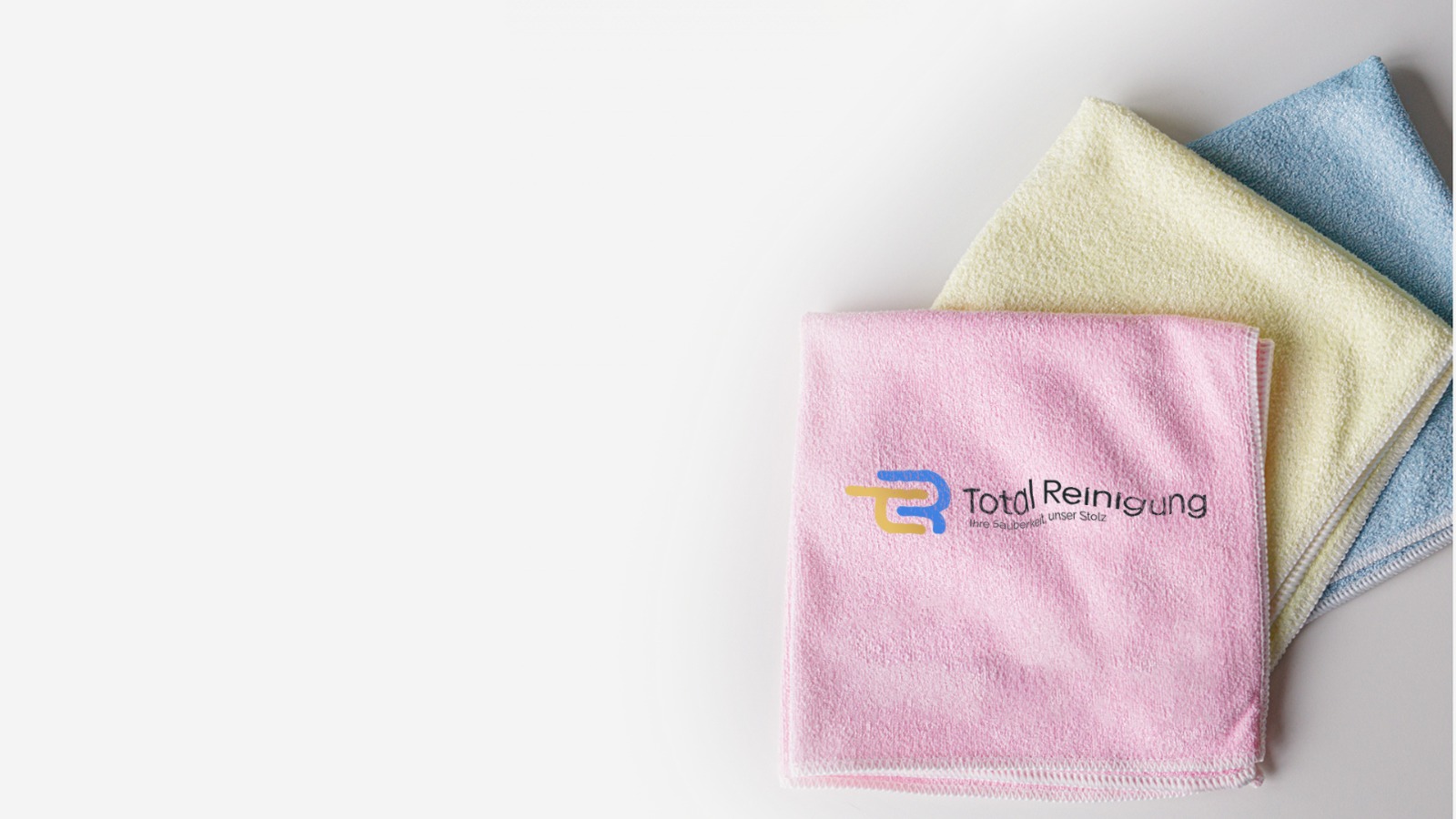 Mikrofasertücher mit Total-Reinigung-Logo für die Zwischenreinigung in Bonn